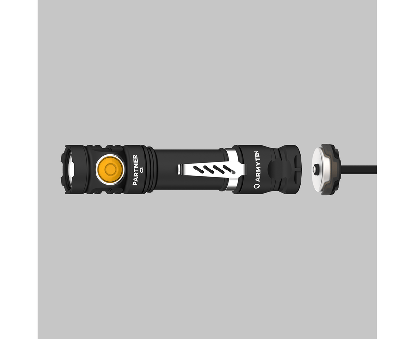 A black Armytek Partner C2 Magnet USB - Warm tactical flashlight with a yellow button and attached charging cable on a gray background.