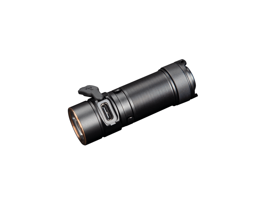 The Fenix E18R V2 is a sleek black cylindrical EDC flashlight equipped with a USB charging port, delivering 1200 lumens of bright, rechargeable LED light. It stands out dramatically against a black background for an impactful visual presentation.