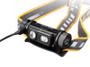 The Fenix HM60R is an outdoor headlamp in black and orange, equipped with a strap and two LED lights capable of delivering up to 1300 lumens. An additional cable connects to the side, enhancing its functionality.