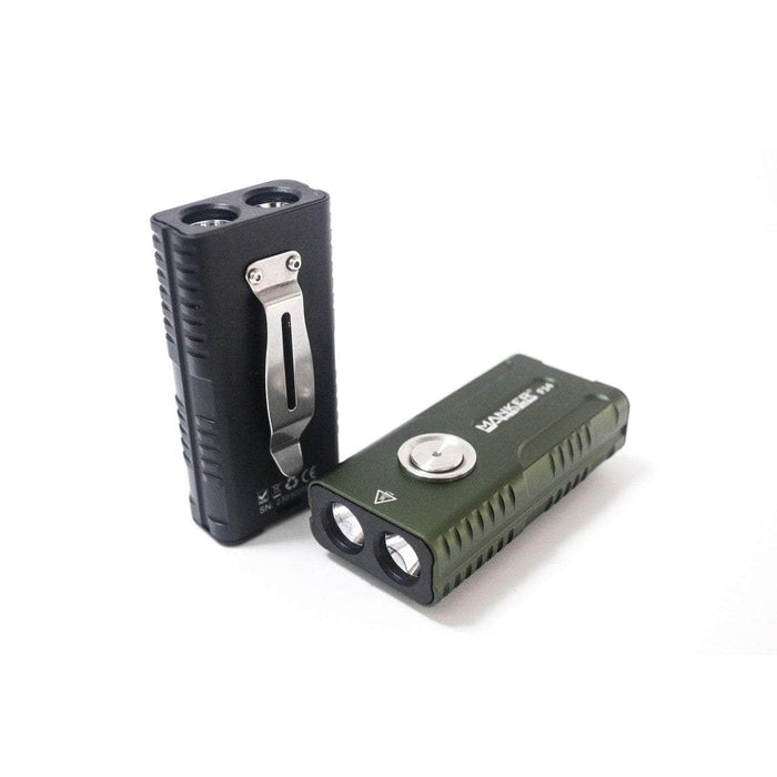 Two small rectangular Manker F14 Flighter Dual Beam Multi-Purpose EDC Flashlights, one black with a metal clip and one green, stand vertically and horizontally against a white background. Both feature dual LED bulbs for a powerful beam at one end.