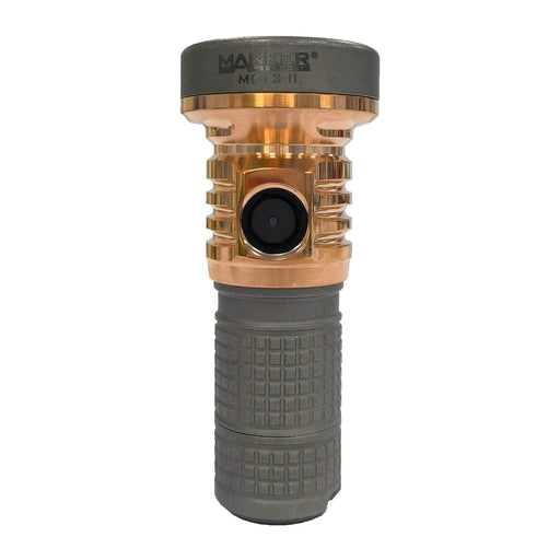 A gold and gray handheld flashlight with a textured grip, featuring the brand name "Manker" printed on the top. This Manker MC13 II Pocket EDC Flashlight - Titanium & Copper boasts a LUMINUS SBT90 GEN2 LED for superior brightness.