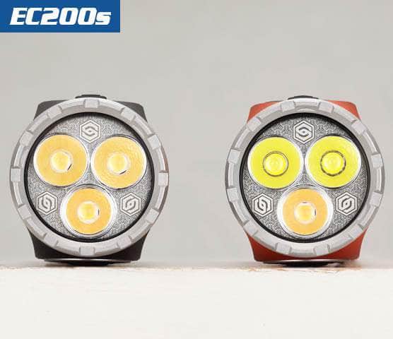 Two USB-C rechargeable Skilhunt EC200S LED flashlights are shown side by side. The left flashlight has a black body while the right has a red body, both emitting up to 2100 lumens with four circular LED lights on the front.