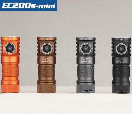 Four Skilhunt EC200S-Mini EDC flashlights in orange, brown, gray, and black colors are arranged side by side against a neutral background. Each flashlight features a USB-C charging port and a solid waterproof rating for reliable use in various conditions.